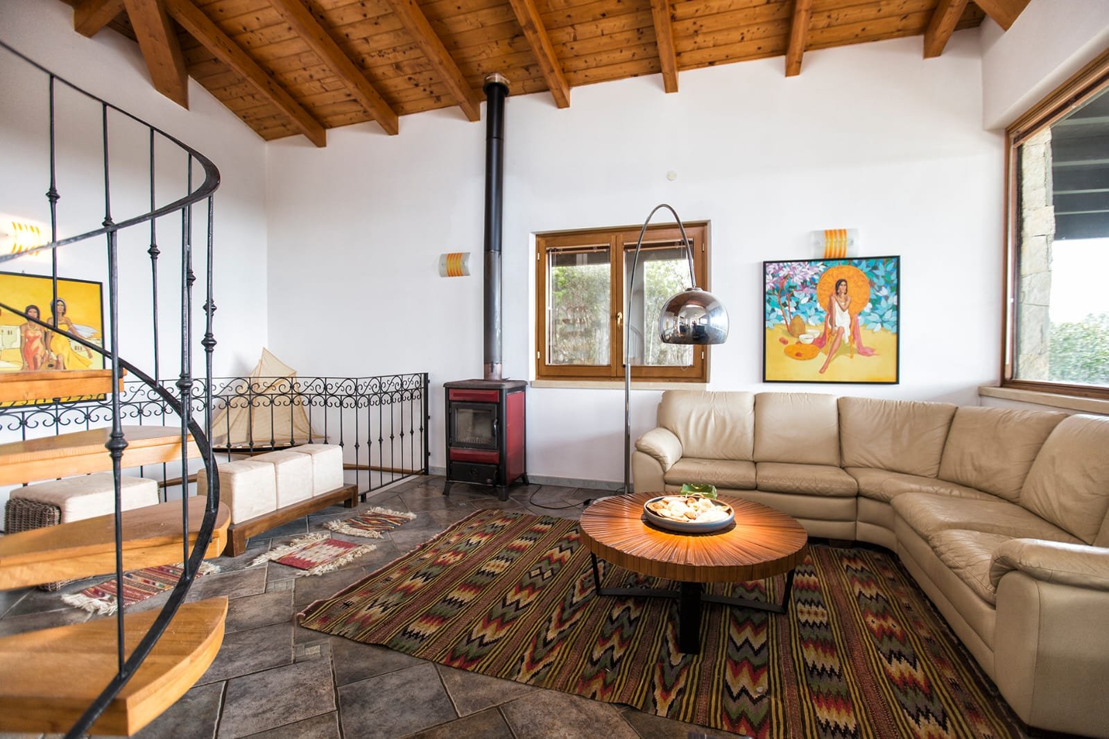 Living room with timber beams and large windows